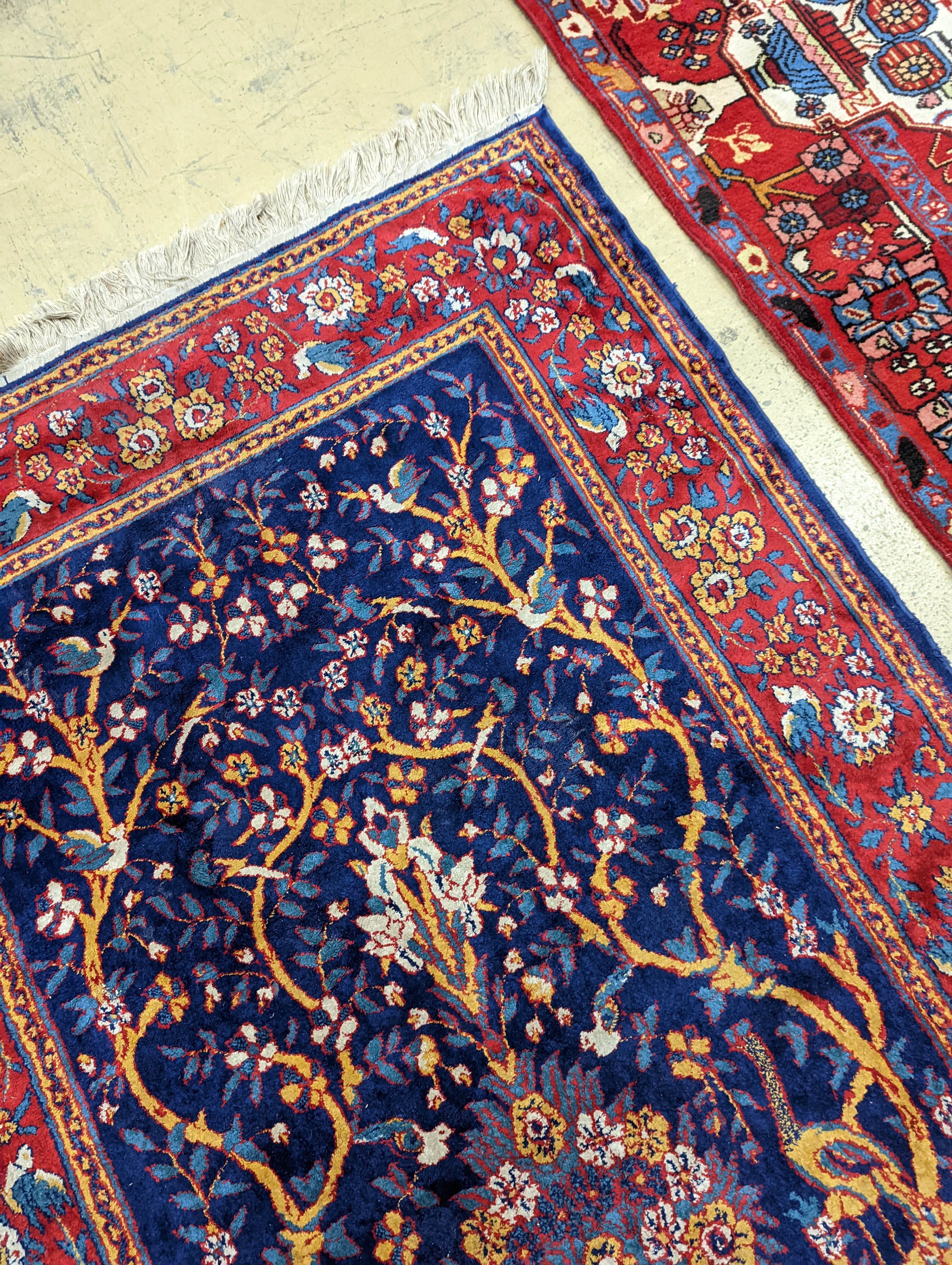 A Caucasian design ivory ground carpet, 260 x 158cm together with a smaller Tabriz style Tree of Life rug